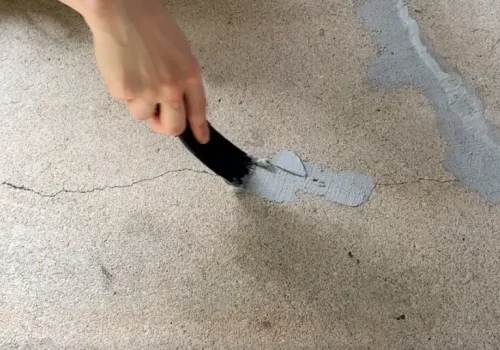 Plastering patching hairline crack.crack repair patching.webp