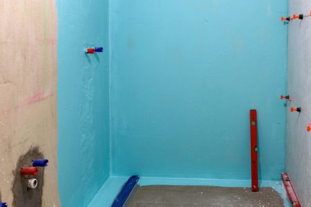 wall waterproofing in a shower cabin. a bathroom in renovation wall waterproofing in a shower cabin. a bathroom in renovation